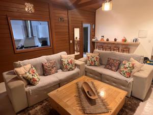 a living room with two couches and a coffee table at Potxi & Cabana in Guriú