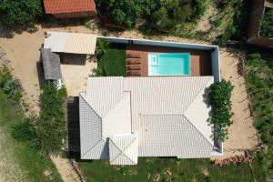 an overhead view of a house with a swimming pool at Potxi & Cabana in Guriú
