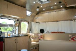 an rv with a kitchen and a sink and a kitchen at Sunrise Suite in Paso Robles