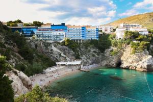 a group of people on a beach in the water at Rooms Cvetka in Dubrovnik