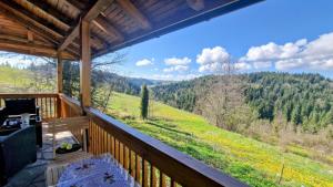 a balcony with a view of a mountain at Imanje Mir in Nova Varoš