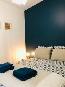 Postel nebo postele na pokoji v ubytování Le studio d'Angèle : Angie