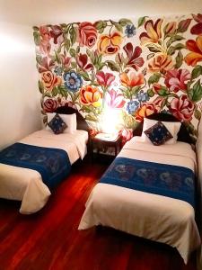 Un pat sau paturi într-o cameră la Casona Dorada Hotel Cusco