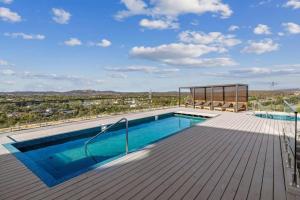 a swimming pool on the deck of a house at 2BR@Luxury&Stylish Top Floor Apt,Pool,Parking,View in Harrison