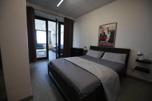 a bedroom with a large bed in a room at Da Zoe in Moncalvo +32 photos