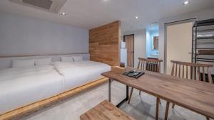 Postel nebo postele na pokoji v ubytování Relax Hotel Takayama Station