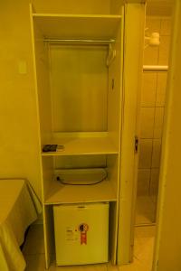 a small bathroom with a toilet in a room at Pousada Shalon Adonai Noronha in Fernando de Noronha