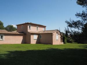 a large house with a green lawn in front of it at Premium villa with garden and private pool, Lambesc in Lambesc