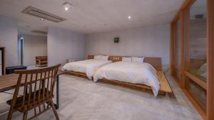 Postel nebo postele na pokoji v ubytování Relax Hotel Takayama Station