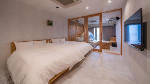 Postel nebo postele na pokoji v ubytování Relax Hotel Takayama Station