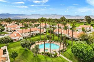 an aerial view of a resort with a pool and palm trees at Desert Falls Diamond - pool, spa, golf, views! in Palm Desert