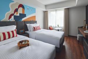 Citadines Harbour Front Yokohama客房内的一张或多张床位