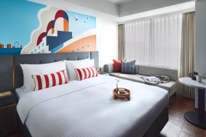Citadines Harbour Front Yokohama客房内的一张或多张床位