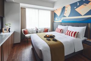 Citadines Harbour Front Yokohama客房内的一张或多张床位