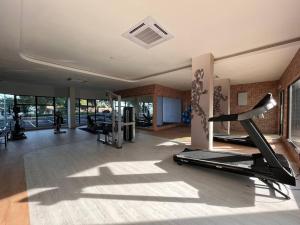 a gym with several treadmills and a treadmill at 2 Bedroom Mutiara Melaka Beach Seaview with Netflix, Wifi, Corner Unit Level 7 Extra Privacy in Malacca