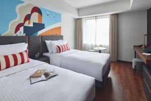 Citadines Harbour Front Yokohama客房内的一张或多张床位