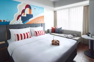 Citadines Harbour Front Yokohama客房内的一张或多张床位