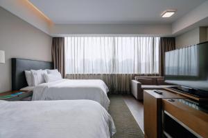 Ένα ή περισσότερα κρεβάτια σε δωμάτιο στο Element Suzhou Science and Technology Town