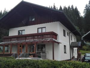 a white house with a red roof at Charming holiday home in Gosau in Gosau