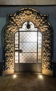 an entrance to a gate with a wrought iron door at Aposento Boutique Hotel in Mexico City