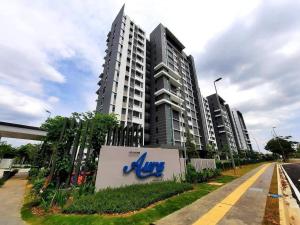 a large apartment building with a sign in front of it at SYG 8 Aura Suite Putrajaya Studio Unit in Putrajaya