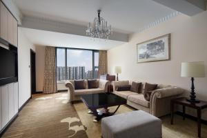 a living room with a couch and a table at Holiday Inn Chengdu Century City-WestTower in Chengdu