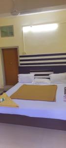 Postel nebo postele na pokoji v ubytování Hotel Orginal Residency