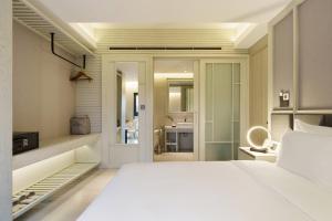 Postel nebo postele na pokoji v ubytování M City Hotel Saigon