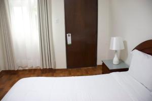 Postel nebo postele na pokoji v ubytování Casablanca Lima