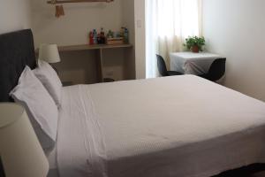 Postel nebo postele na pokoji v ubytování Casablanca Lima