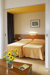 Posteľ alebo postele v izbe v ubytovaní Appartement in Castell-Platja D'aro mit Garten, gemeinsamem Pool und Terrasse