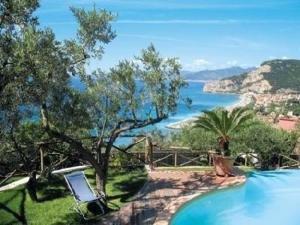 a swimming pool with a view of the ocean at Ferienwohnung in Finale Ligure mit Großem Garten in Finale Ligure