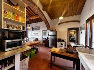 a kitchen with a table and a counter top at Eroico sul Mare in Portoferraio