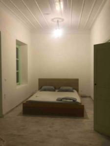 Кровать или кровати в номере Kastellorizo- Entire Traditional House