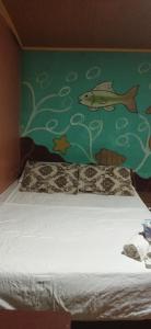 Llit o llits en una habitació de Ofiuras Hostal