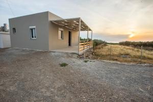 a house in the middle of a field at heaven suite elafonisi in Elafonisi