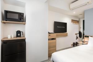 TV a/nebo společenská místnost v ubytování Tokyu Stay Shibuya Shin-Minamiguchi