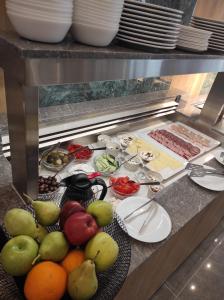 a bunch of fruits and vegetables on a table at Santa Maria City Hotel in Rhodes Town