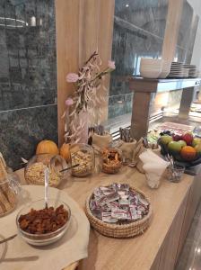 a table topped with lots of different types of food at Santa Maria City Hotel in Rhodes Town