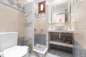 a bathroom with a toilet and a sink and a shower at Amaranto Naxos 2 in Naxos Chora