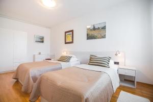 Posteľ alebo postele v izbe v ubytovaní Penthouse apartment with private parking