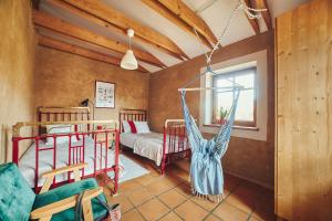 a bedroom with two bunk beds and a window at SPOKÓJ & DOBRO - slow life apartments in Gąski