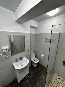 a bathroom with a sink and a toilet at Ayan Luxury By Complex Almar in Mamaia Sat/Năvodari +21 photos