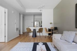 a living room with a couch and a table at U Street 1br w gym wd nr metro dining WDC-676 in Washington +39 photos