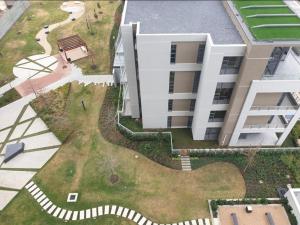 an aerial view of a building with a yard at Menlyn Maine Apartments in Pretoria