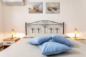 Postel nebo postele na pokoji v ubytování Appartamento Potenza 50 mt mare - Apulia Home