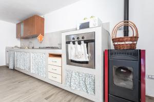 Kuchyň nebo kuchyňský kout v ubytování Appartamento Potenza 50 mt mare - Apulia Home