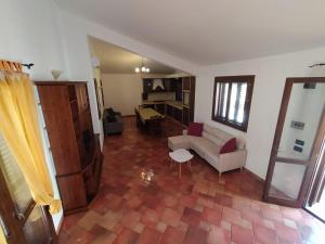 a living room with a couch and a table at SanVitoTour- Residence Il Baglio in San Vito lo Capo