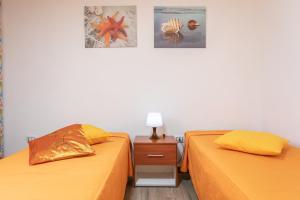 Postel nebo postele na pokoji v ubytování Appartamento Potenza 50 mt mare - Apulia Home