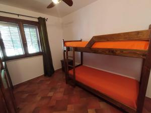 a room with two bunk beds and a window at SanVitoTour- Residence Il Baglio in San Vito lo Capo